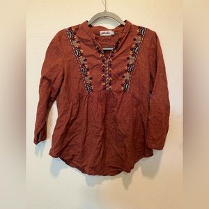 Hand woven blouse.